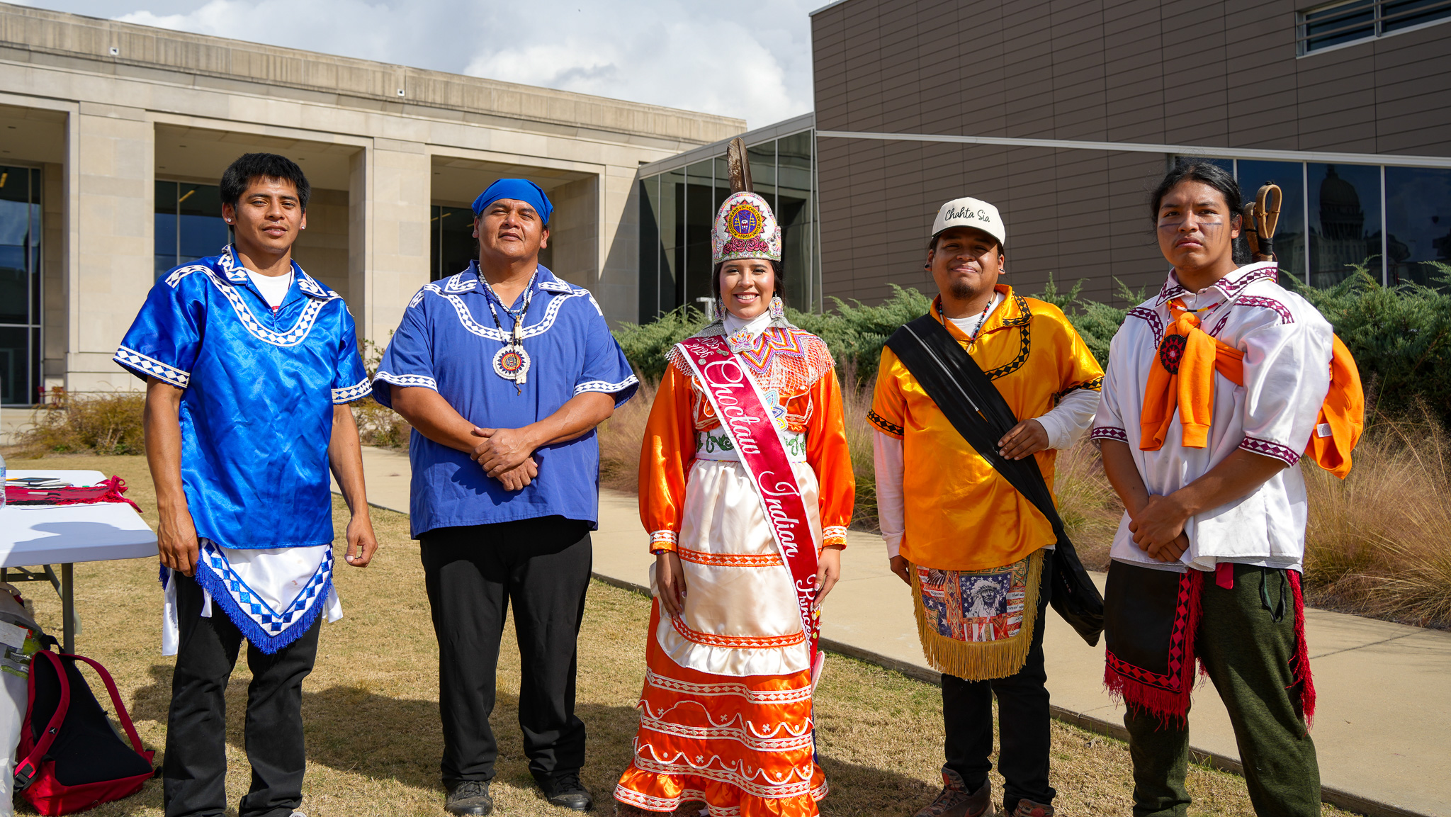 Members of the Mississippi Band of Choctaw Indians stand outside of the Two Mississippi Museums.