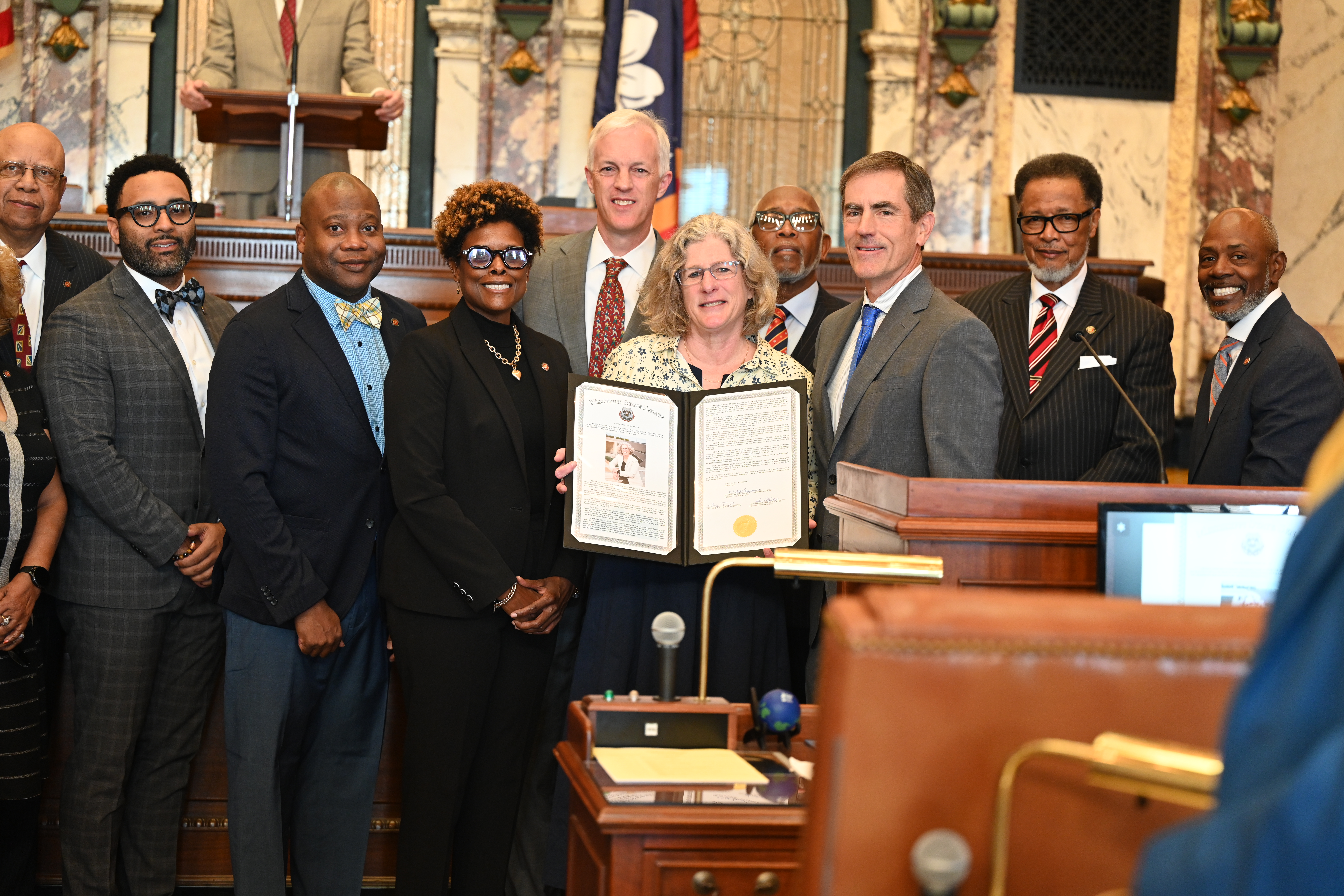 Katie poses with Senators 
