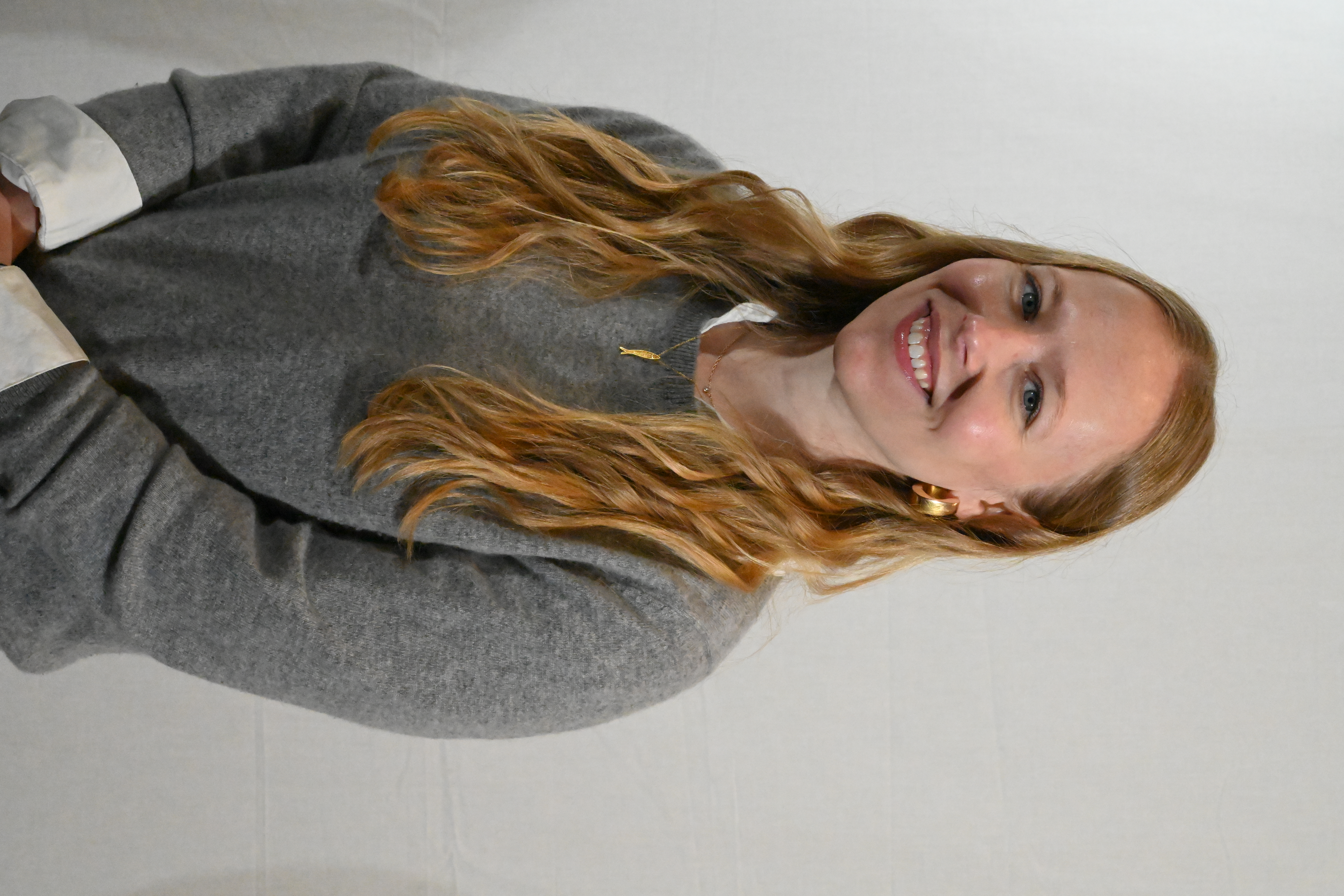 Meredith smiles at the camera